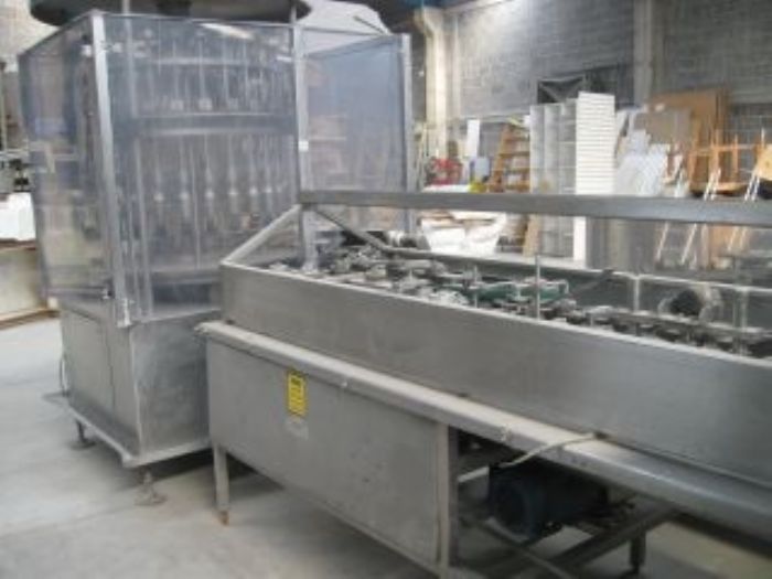 Llenadora rotativa de Liquidos y aproximadora de Botellas - 